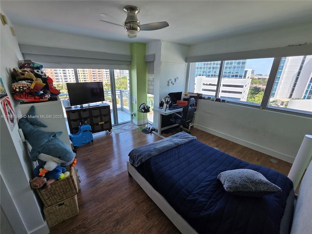 2950 NE 188th St Unit 501, Aventura, FL 33180 - bedroom featuring access to outside, wood finished floors, baseboards, and a ceiling fan