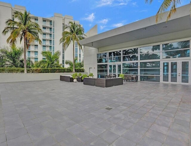 2950 NE 188th St Unit 501, Aventura, FL 33180 - view of patio / terrace with an outdoor hangout area and french doors