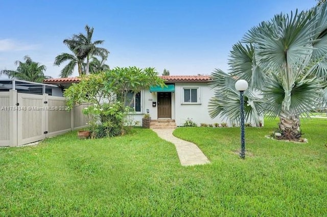 1321 S 16th Ave, Hollywood, FL 33020 - view of front of property featuring a tiled roof and stucco siding