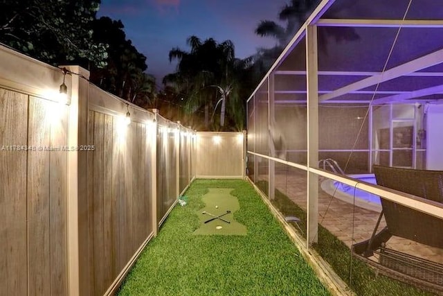 1321 S 16th Ave, Hollywood, FL 33020 - fenced backyard featuring an area to practice putting and glass enclosure