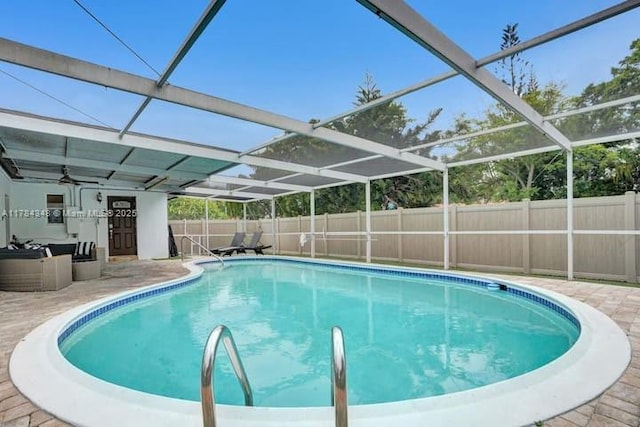 1321 S 16th Ave, Hollywood, FL 33020 - view of swimming pool with a fenced backyard, a patio, glass enclosure, and ceiling fan