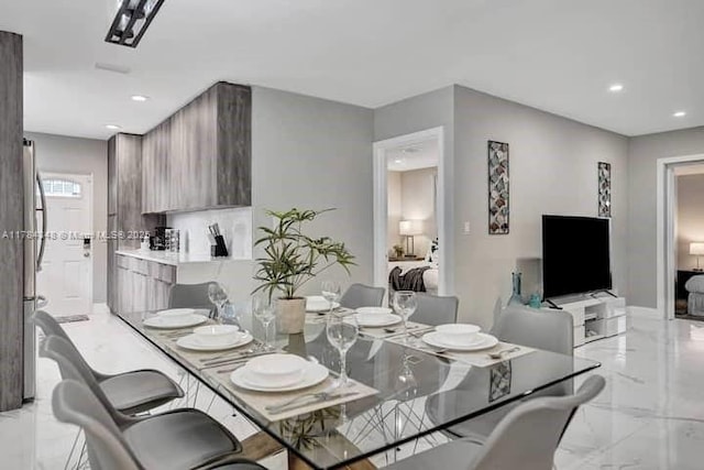 1321 S 16th Ave, Hollywood, FL 33020 - dining space featuring light marble finish flooring, recessed lighting, and baseboards