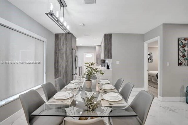 1321 S 16th Ave, Hollywood, FL 33020 - dining space featuring marble tiled flooring and baseboards