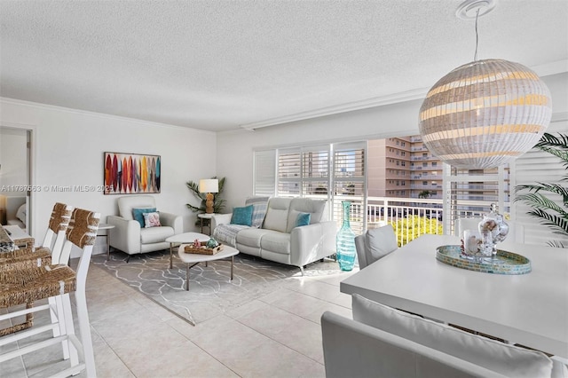 living room featuring light tile patterned floors, a textured ceiling, and ornamental molding