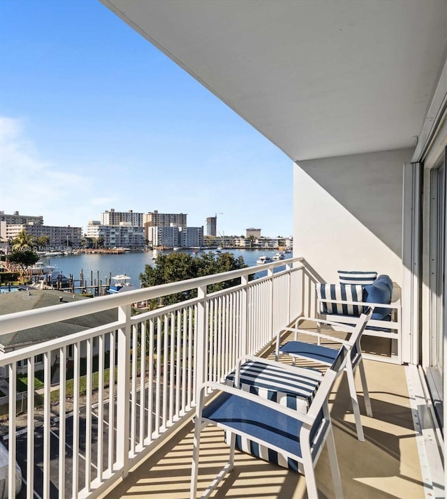 balcony with a city view and a water view