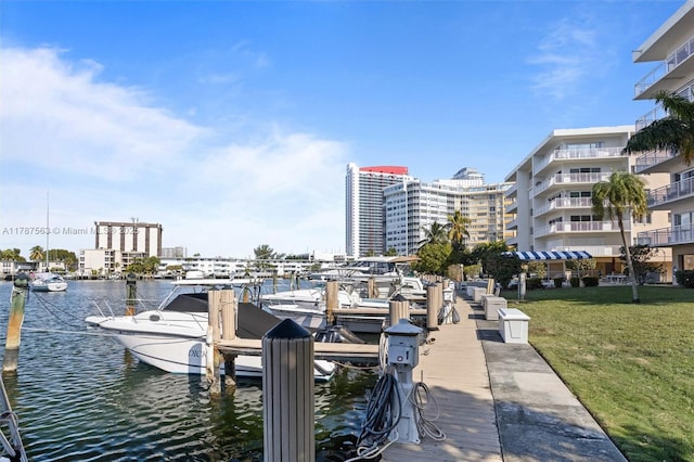 dock area featuring a yard and a water view