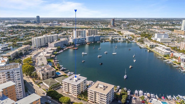 birds eye view of property with a city view and a water view