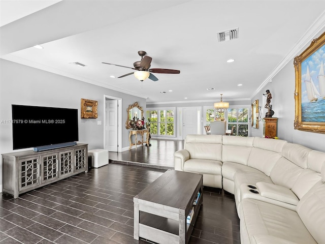 4231 NE 16th Ave, Oakland Park, FL 33334 - living room with crown molding, a ceiling fan, recessed lighting, wood finished floors, and a chandelier