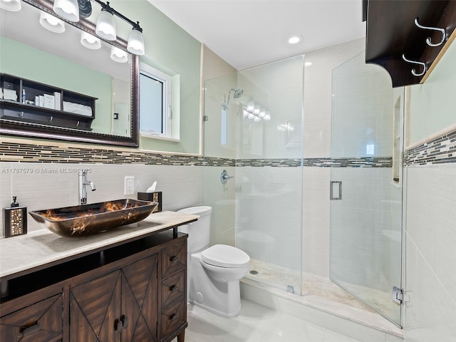 4231 NE 16th Ave, Oakland Park, FL 33334 - bathroom with a shower stall, toilet, vanity, and tile walls