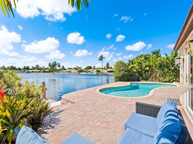 4231 NE 16th Ave, Oakland Park, FL 33334 - swimming pool featuring a patio area and a water view
