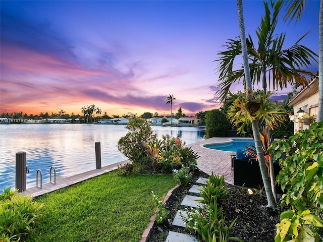 4231 NE 16th Ave, Oakland Park, FL 33334 - view of yard featuring a water view and an outdoor pool