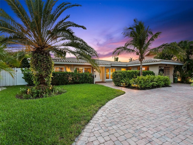 4231 NE 16th Ave, Oakland Park, FL 33334 - view of front of home featuring stucco siding and a tiled roof