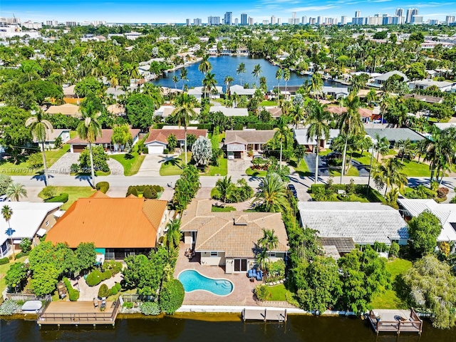 4231 NE 16th Ave, Oakland Park, FL 33334 - aerial perspective of suburban area with a nearby body of water, city skyline, and a pool
