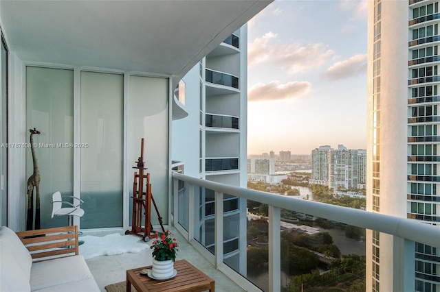 15901 Collins Ave Unit 2502, Sunny Isles Beach, FL 33160 - balcony at dusk featuring a city view