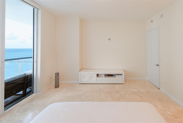 15901 Collins Ave Unit 2502, Sunny Isles Beach, FL 33160 - unfurnished bedroom featuring baseboards and a water view