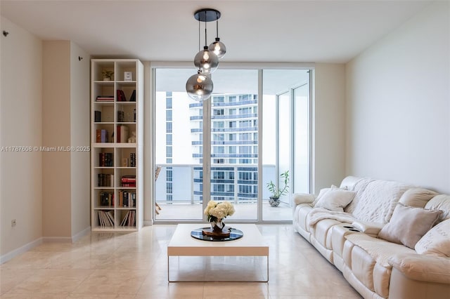 15901 Collins Ave Unit 2502, Sunny Isles Beach, FL 33160 - living room with a wall of windows and baseboards