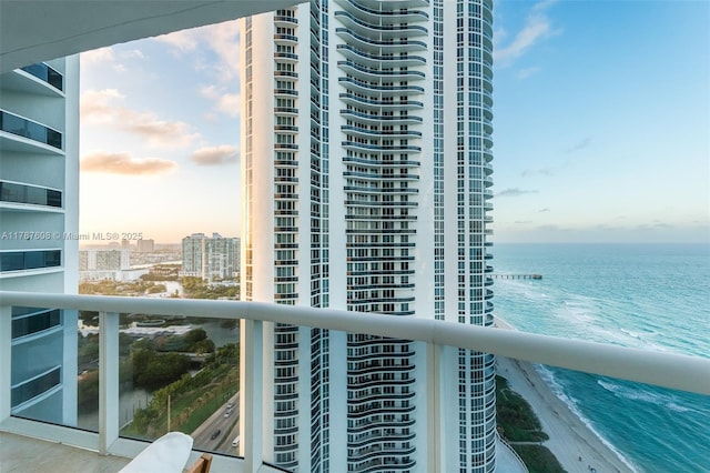 15901 Collins Ave Unit 2502, Sunny Isles Beach, FL 33160 - balcony at dusk featuring a city view and a water view
