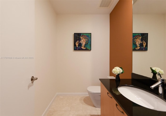 15901 Collins Ave Unit 2502, Sunny Isles Beach, FL 33160 - bathroom featuring toilet, vanity, baseboards, tile patterned flooring, and visible vents