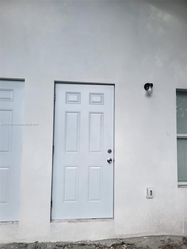 4295 NW 32nd Ave, Miami, FL 33142 - property entrance with stucco siding