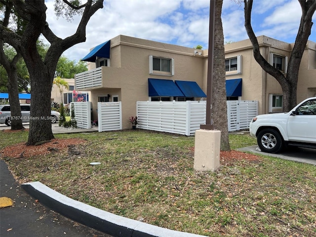 view of side of home with stucco siding