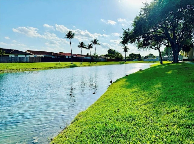 view of water feature with fence