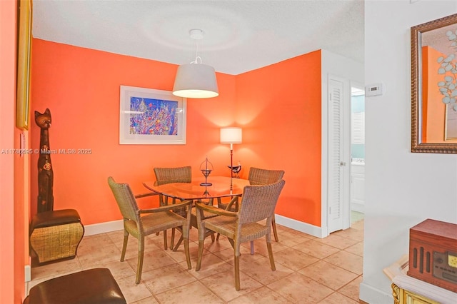 2500 NE 9th St Unit 111, Fort Lauderdale, FL 33304 - dining room with baseboards and tile patterned flooring