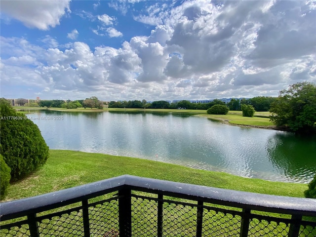 property view of water featuring fence
