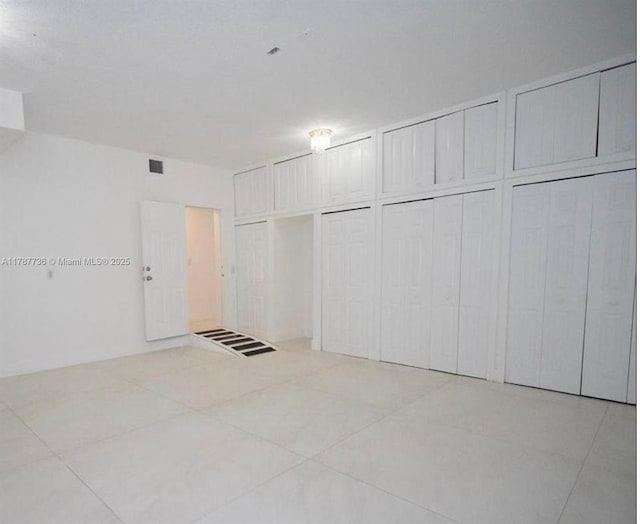 interior space with light tile patterned floors