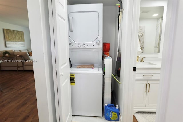 12500 SW 6th St Unit 413N, Pembroke Pines, FL 33027 - laundry room with wood finished floors, stacked washer and dryer, laundry area, and a sink