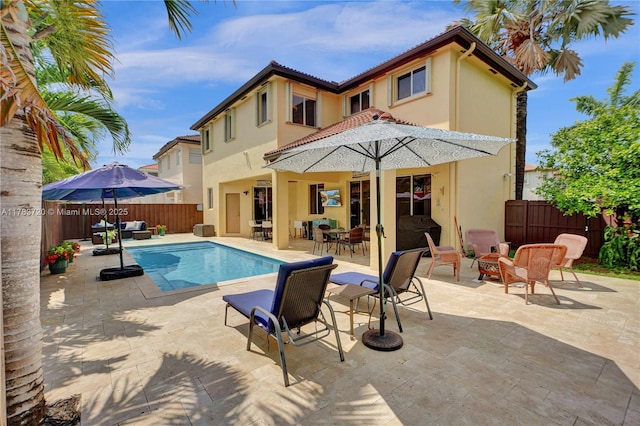view of swimming pool featuring a patio area, outdoor lounge area, outdoor dining space, a fenced backyard, and a fenced in pool