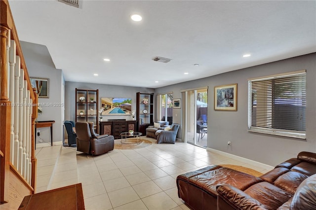living area with stairway, visible vents, recessed lighting, and light tile patterned floors