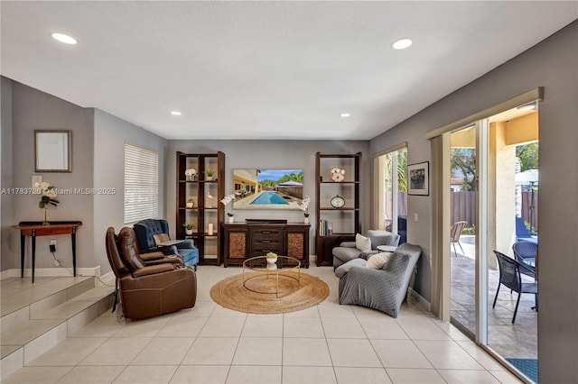 sitting room with a fireplace, recessed lighting, and light tile patterned floors