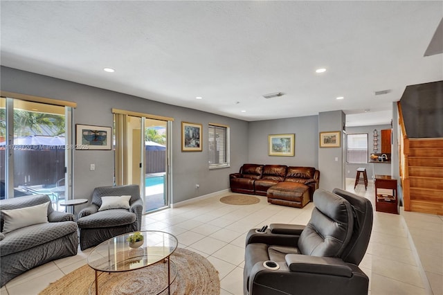 living area with baseboards, recessed lighting, visible vents, and light tile patterned floors