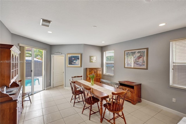 dining area with visible vents, baseboards, and a healthy amount of sunlight