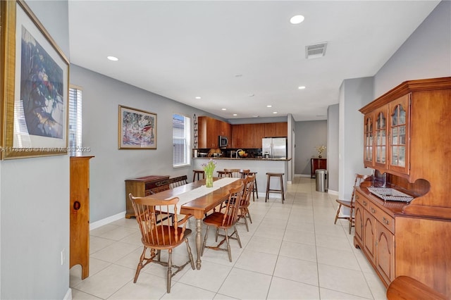 dining room with baseboards, visible vents, recessed lighting, and light tile patterned floors