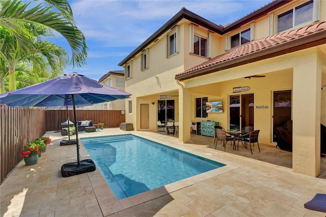 view of swimming pool with a fenced in pool, a fenced backyard, outdoor dining space, a patio, and an outdoor living space