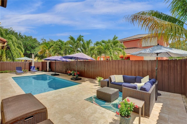 view of pool with a patio area, a fenced backyard, and outdoor lounge area