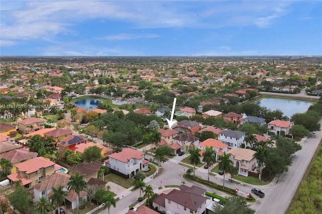 bird's eye view featuring a residential view and a water view