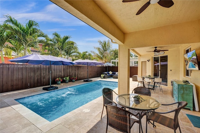 view of pool with outdoor dining area, a fenced backyard, a fenced in pool, a patio, and ceiling fan