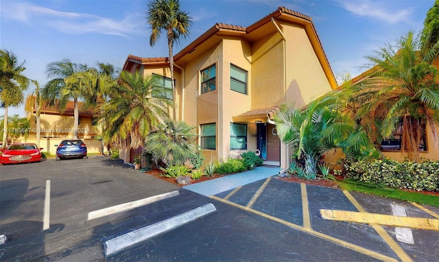 11282 SW 9th Ct, Pembroke Pines, FL 33025 - view of building exterior featuring uncovered parking