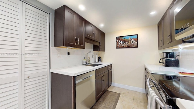 11282 SW 9th Ct, Pembroke Pines, FL 33025 - kitchen featuring stainless steel appliances, a sink, tasteful backsplash, dark brown cabinets, and recessed lighting