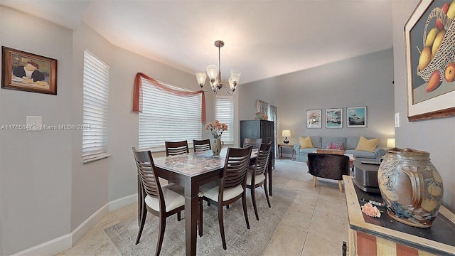 11282 SW 9th Ct, Pembroke Pines, FL 33025 - dining space with a chandelier, light tile patterned flooring, and baseboards