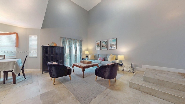 11282 SW 9th Ct, Pembroke Pines, FL 33025 - living room featuring high vaulted ceiling, light tile patterned floors, and baseboards