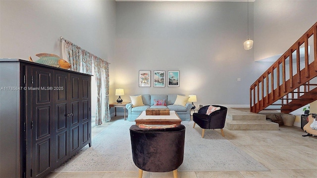 11282 SW 9th Ct, Pembroke Pines, FL 33025 - living room with stairs, a towering ceiling, and light tile patterned flooring