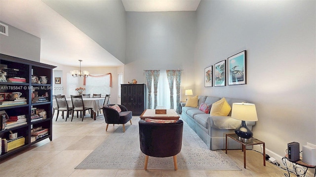 11282 SW 9th Ct, Pembroke Pines, FL 33025 - tiled living room featuring a chandelier, a towering ceiling, and baseboards