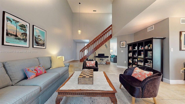 11282 SW 9th Ct, Pembroke Pines, FL 33025 - living room with stairway, light tile patterned floors, a high ceiling, and baseboards