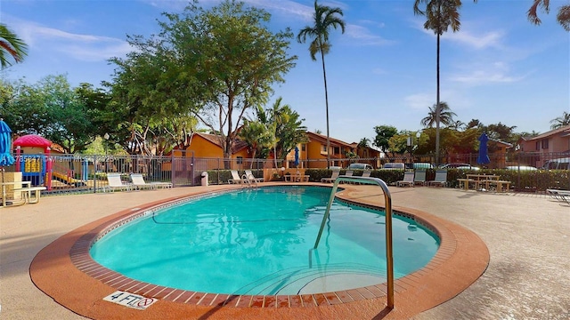 11282 SW 9th Ct, Pembroke Pines, FL 33025 - community pool with fence and a patio area