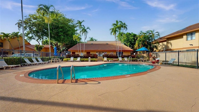 11282 SW 9th Ct, Pembroke Pines, FL 33025 - community pool with a patio area and fence