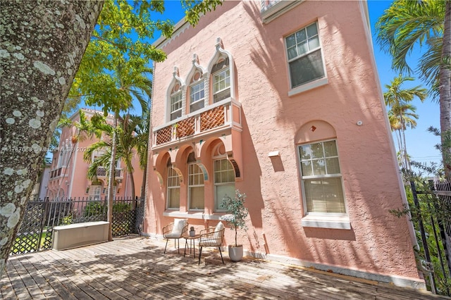 760 Meridian Ave Unit 1, Miami Beach, FL 33139 - rear view of house featuring fence and stucco siding