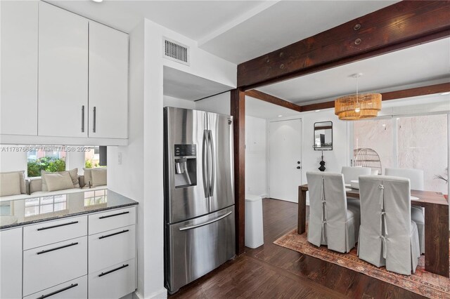 760 Meridian Ave Unit 1, Miami Beach, FL 33139 - kitchen featuring visible vents, stainless steel refrigerator with ice dispenser, white cabinetry, and dark stone countertops